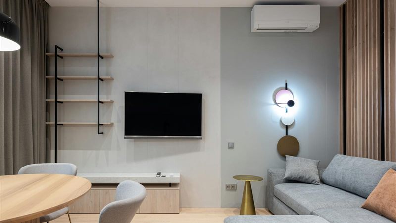 Wall-mounted ductless mini-split air conditioner in a bright living room