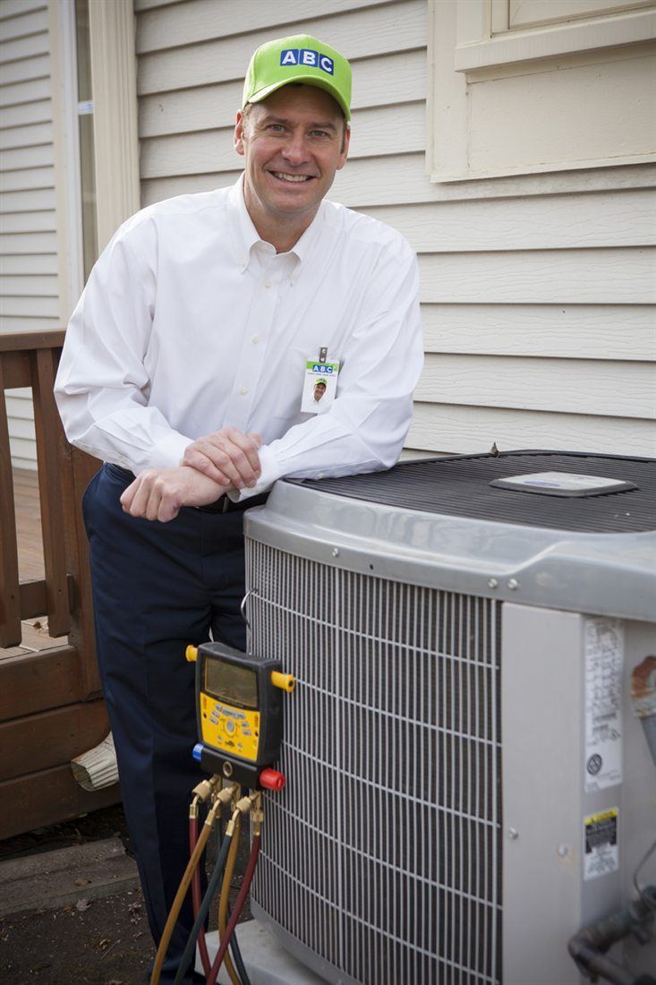 ABC technician repairing a home air conditioning unit