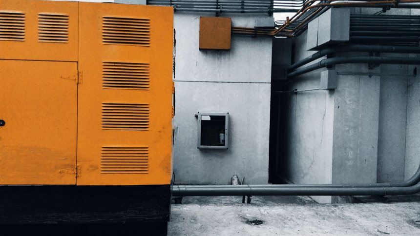Standby backup generator unit outside a building