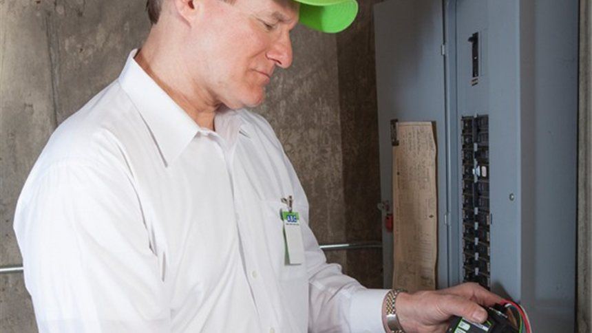 ABC electrician testing a home breaker panel