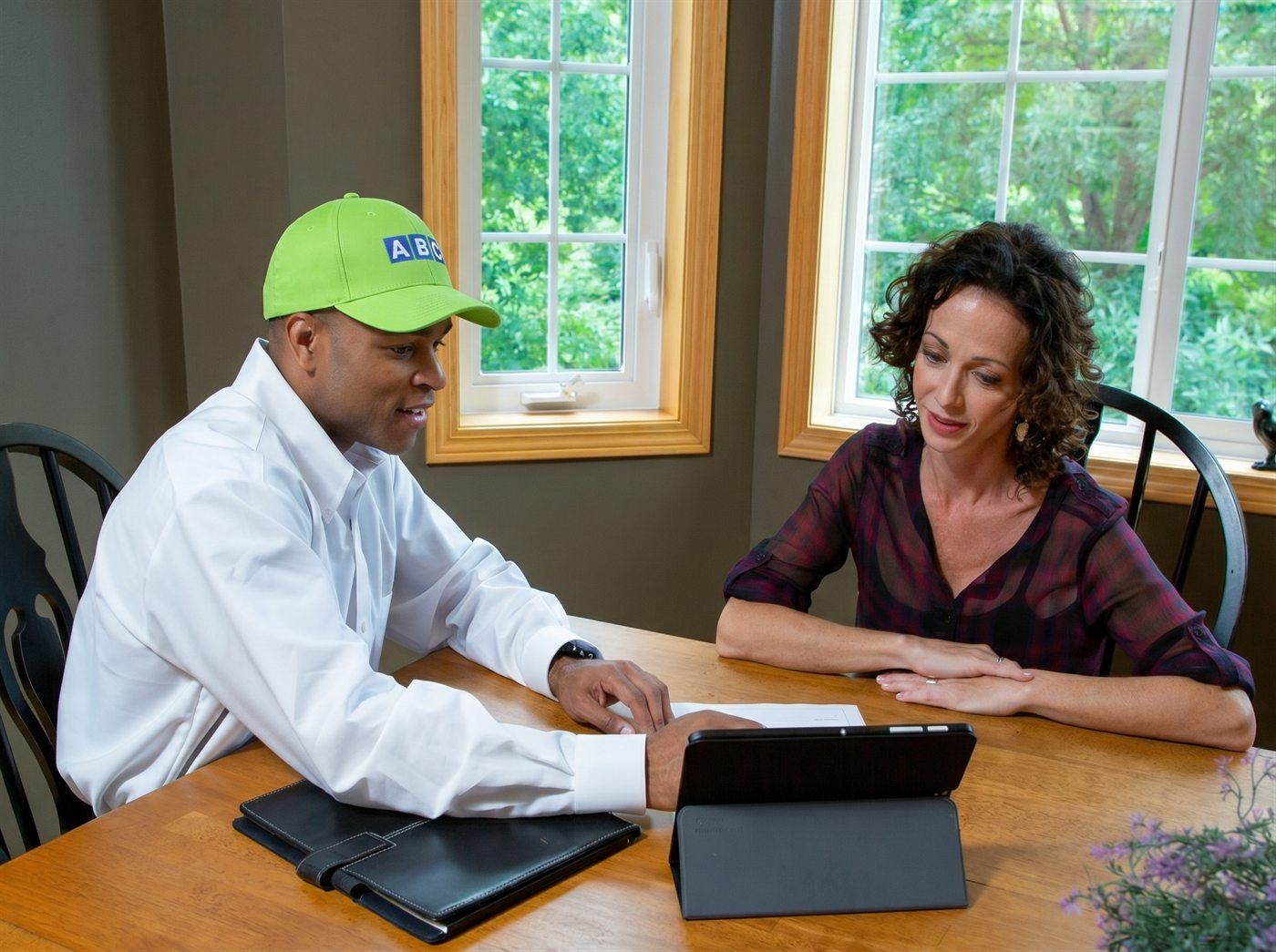 ABC technician reviewing drain and sewer options with a homeowner